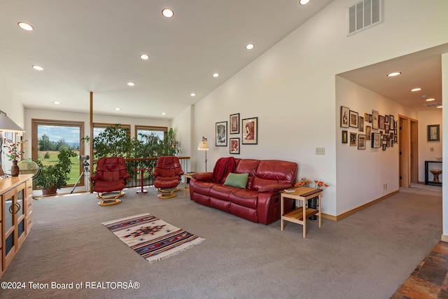 1820 Fall Line Dr, Driggs, ID 83422 - carpeted living area with high vaulted ceiling, baseboards, visible vents, and recessed lighting