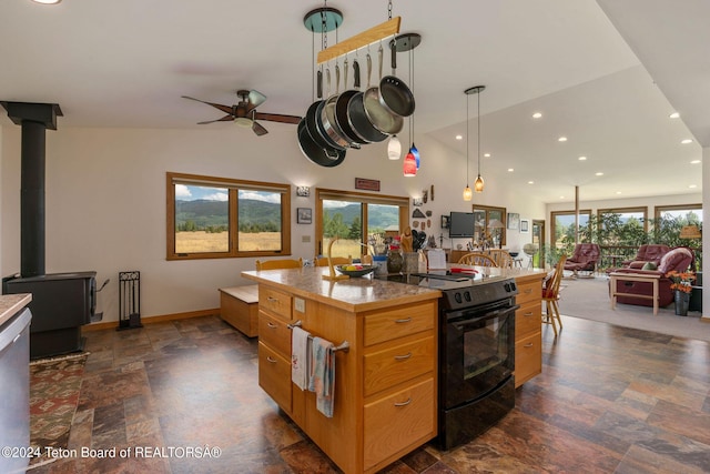 1820 Fall Line Dr, Driggs, ID 83422 - kitchen featuring open floor plan, ceiling fan, black electric range oven, and a wealth of natural light