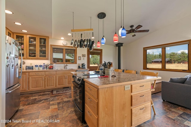 1820 Fall Line Dr, Driggs, ID 83422 - kitchen featuring electric range, a ceiling fan, freestanding refrigerator, stone finish floor, and light brown cabinetry