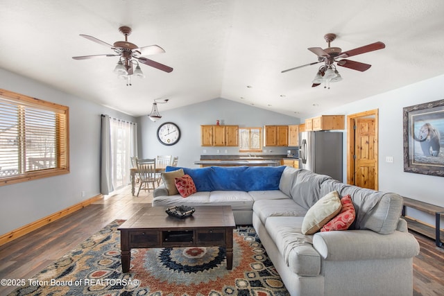 living area featuring dark wood-style flooring, ceiling fan, and vaulted ceiling