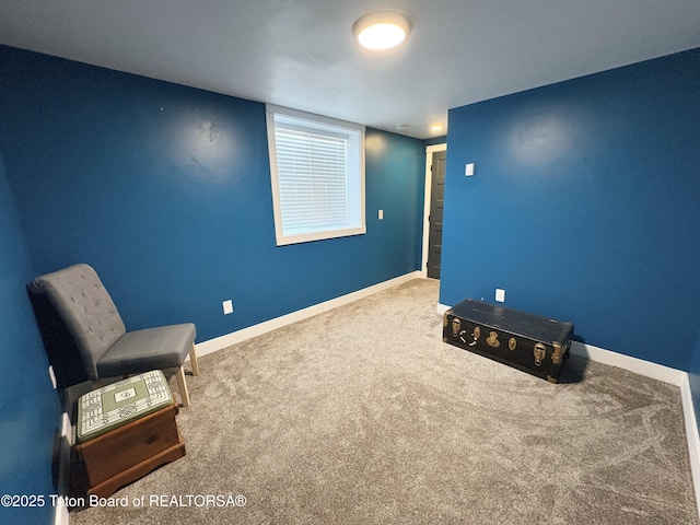 unfurnished room featuring baseboards and carpet floors