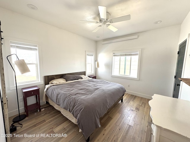 bedroom featuring ceiling fan, light wood finished floors, baseboards, and recessed lighting