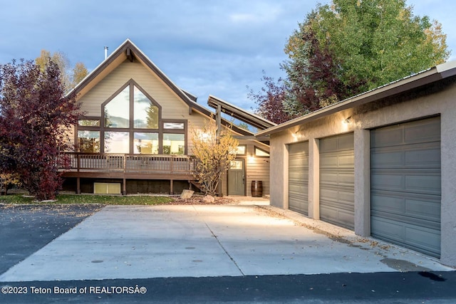 17 C B Ln, Pinedale, WY 82941 - chalet / cabin with a garage, driveway, and a wooden deck