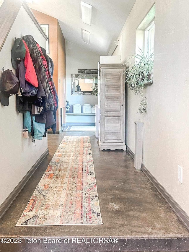 17 C B Ln, Pinedale, WY 82941 - hall with vaulted ceiling, baseboards, and dark wood finished floors