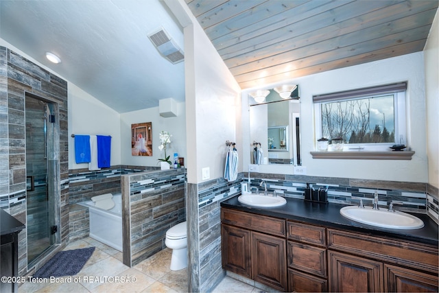17 C B Ln, Pinedale, WY 82941 - full bath with tile walls, vaulted ceiling, a bath, tile patterned floors, and double vanity
