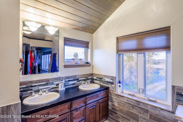 17 C B Ln, Pinedale, WY 82941 - bathroom with double vanity, lofted ceiling, wooden ceiling, and a walk in closet