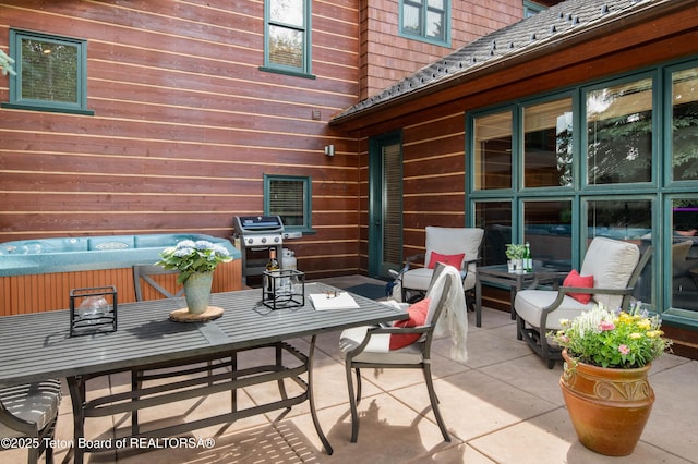 3723 W Michael Dr Unit 13, Teton Village, WY 83025 - view of patio with grilling area and a hot tub