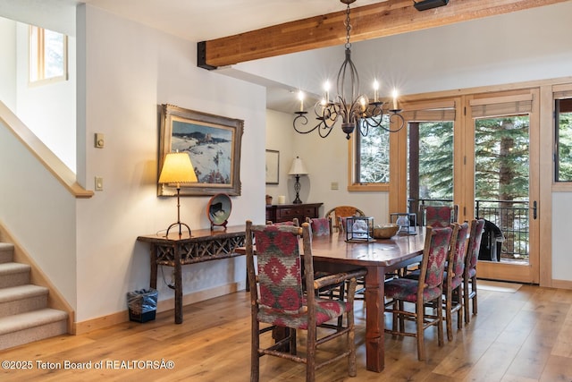 3723 W Michael Dr Unit 13, Teton Village, WY 83025 - dining area featuring beamed ceiling, stairway, a chandelier, and light wood-type flooring