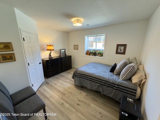 3048 Rangeview Dr, Jackson, WY 83001 - bedroom with light wood finished floors and visible vents