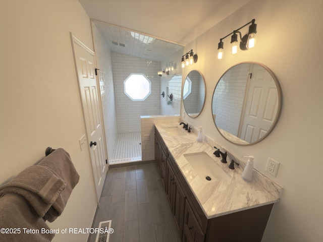 3048 Rangeview Dr, Jackson, WY 83001 - full bath featuring walk in shower, double vanity, a sink, and wood finished floors
