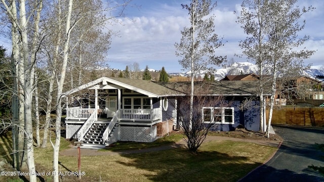 3048 Rangeview Dr, Jackson, WY 83001 - exterior space with a yard, stairs, covered porch, and aphalt driveway