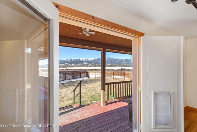 708 Palisades Ln, Alpine, WY 83128 - doorway to outside featuring a mountain view, ceiling fan, vaulted ceiling, and wood finished floors