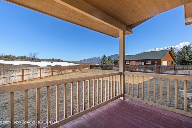 708 Palisades Ln, Alpine, WY 83128 - wooden terrace with a mountain view and a fenced backyard
