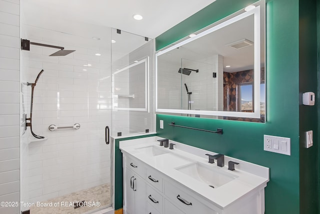 708 Palisades Ln, Alpine, WY 83128 - bathroom with a sink, visible vents, double vanity, and a stall shower