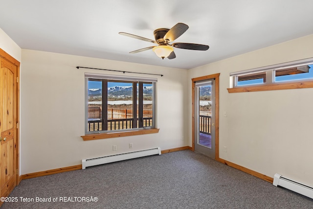 708 Palisades Ln, Alpine, WY 83128 - empty room with carpet floors, ceiling fan, a baseboard heating unit, and baseboards