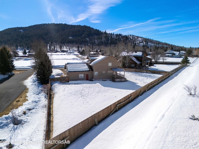 708 Palisades Ln, Alpine, WY 83128 - snowy yard with a mountain view