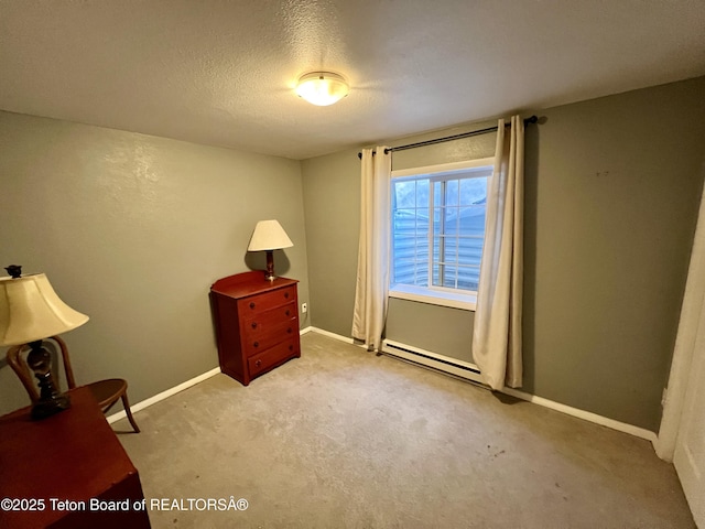 living area with a baseboard radiator, carpet flooring, baseboards, and a textured ceiling