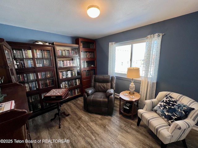 sitting room with wood finished floors