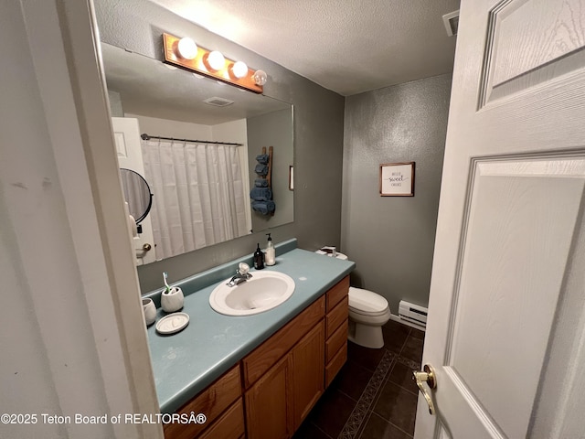 full bath with vanity, a baseboard heating unit, tile patterned flooring, toilet, and visible vents