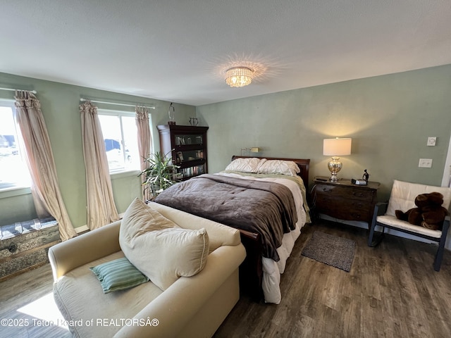 bedroom with wood finished floors
