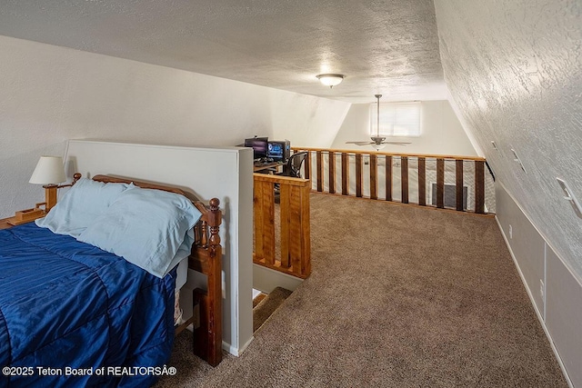 102295 US Highway 89, Thayne, WY 83127 - carpeted bedroom featuring a textured ceiling and vaulted ceiling