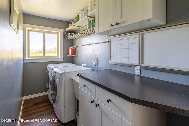 102295 US Highway 89, Thayne, WY 83127 - washroom with independent washer and dryer, cabinet space, dark wood-style floors, and baseboards