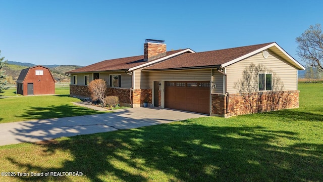 102295 US Highway 89, Thayne, WY 83127 - ranch-style house with a front lawn, a garage, a chimney, and brick siding