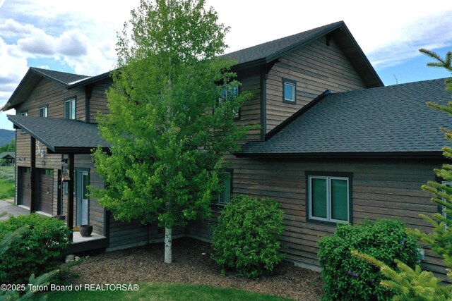 9075 Nesting Eagles Loop, Victor, ID 83455 - view of home's exterior with roof with shingles