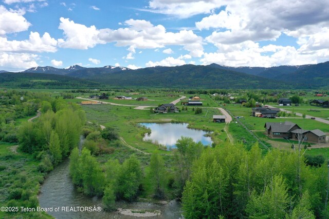 9075 Nesting Eagles Loop, Victor, ID 83455 - view of mountain background featuring a large body of water and rural landscape