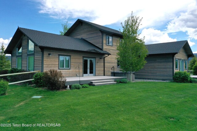 9075 Nesting Eagles Loop, Victor, ID 83455 - back of house with french doors, a hot tub, and a patio