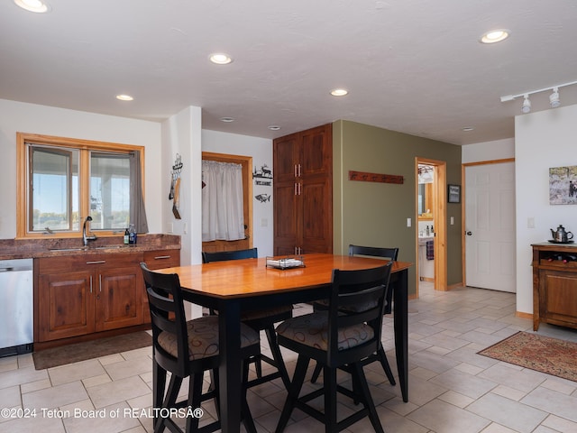 dining space with baseboards and recessed lighting