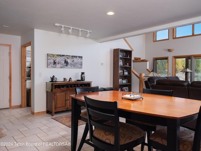 dining area with baseboards, recessed lighting, and light tile patterned flooring