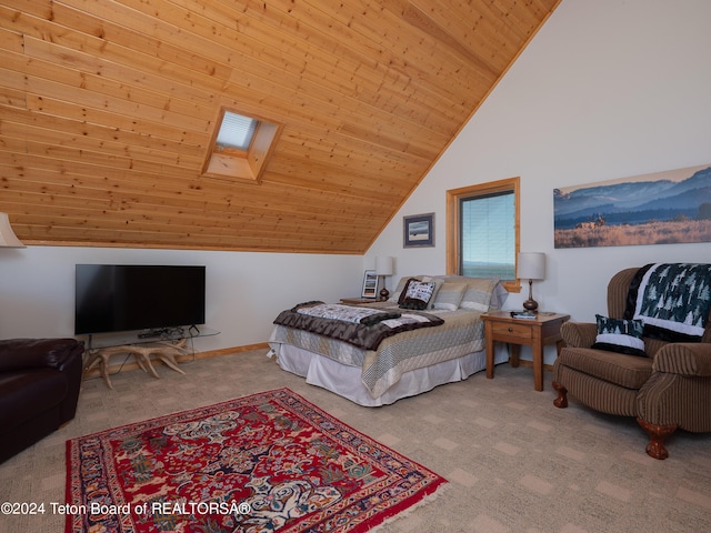 carpeted bedroom with wooden ceiling and lofted ceiling with skylight