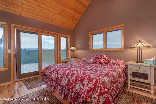 bedroom featuring high vaulted ceiling, wood ceiling, wood finished floors, and access to exterior
