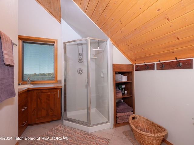 full bathroom featuring vaulted ceiling, tile patterned flooring, and a stall shower