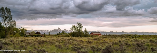 yard at dusk with a mountain view