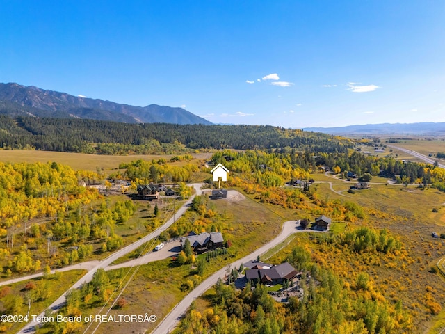 604 Falcon Dr, Alpine, WY 83128 - birds eye view of property featuring a forest view and a mountain view