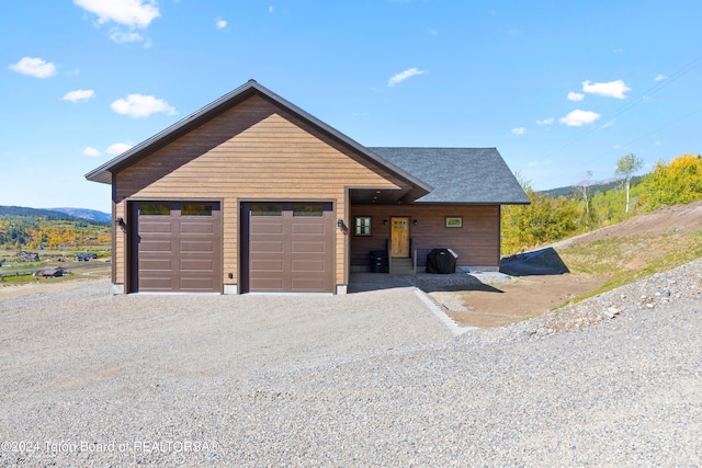 604 Falcon Dr, Alpine, WY 83128 - rustic home with driveway and a mountain view