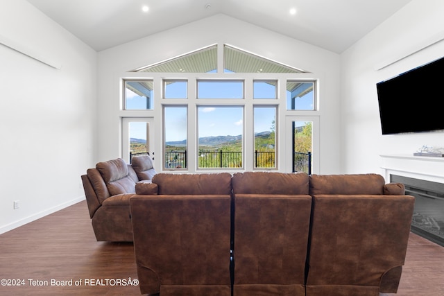 604 Falcon Dr, Alpine, WY 83128 - living room with recessed lighting, vaulted ceiling, wood finished floors, baseboards, and a fireplace