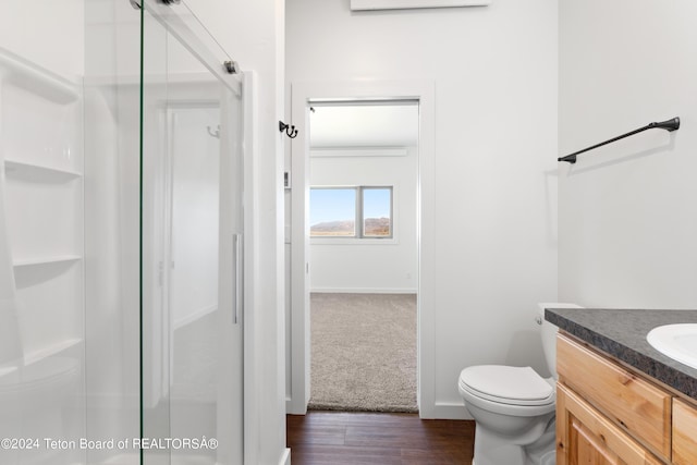 604 Falcon Dr, Alpine, WY 83128 - full bath with a shower stall, toilet, vanity, and wood finished floors