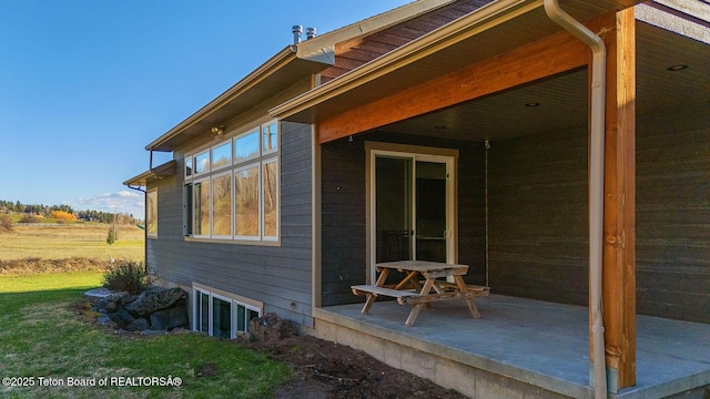 view of property exterior featuring a patio area