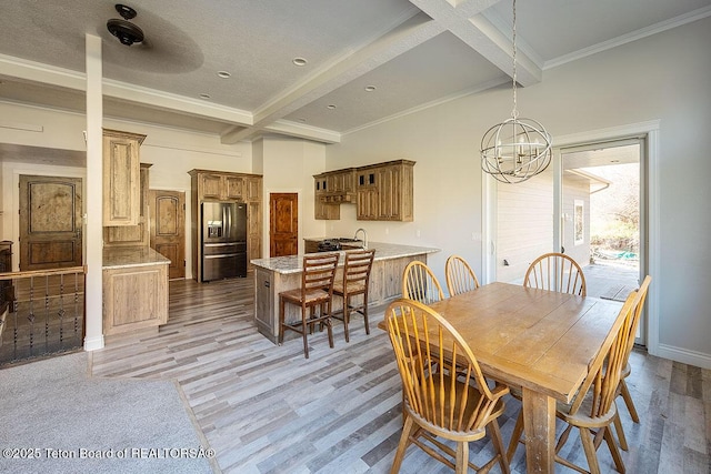 dining space with beamed ceiling, a chandelier, light wood finished floors, coffered ceiling, and ornamental molding