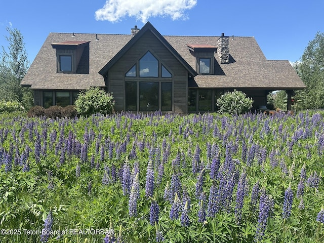 37 Rammell Rd, Victor, ID 83455 - back of house with a chimney and a shingled roof
