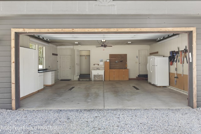 332 N Forest Dr, Star Valley Ranch, WY 83127 - garage with freestanding refrigerator and a ceiling fan