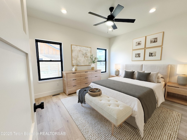 668 Palisade Trl, Driggs, ID 83422 - bedroom with multiple windows, light wood finished floors, recessed lighting, and ceiling fan