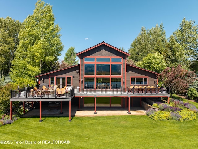 4053 S Adams Rd, Driggs, ID 83422 - rear view of house featuring a deck and a yard