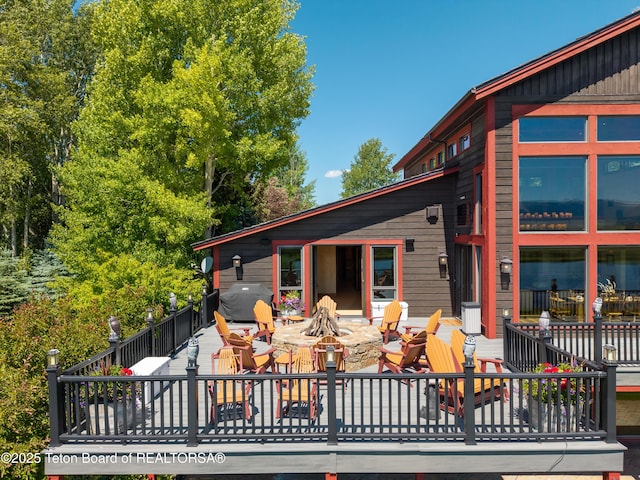 4053 S Adams Rd, Driggs, ID 83422 - exterior space featuring a fire pit, a wooden deck, and a patio