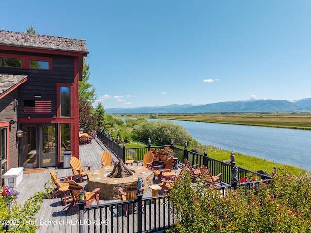 4053 S Adams Rd, Driggs, ID 83422 - view of patio / terrace with a fire pit and a deck with water view
