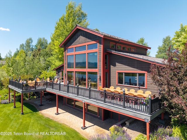 4053 S Adams Rd, Driggs, ID 83422 - rear view of property with a deck, a lawn, and a patio area
