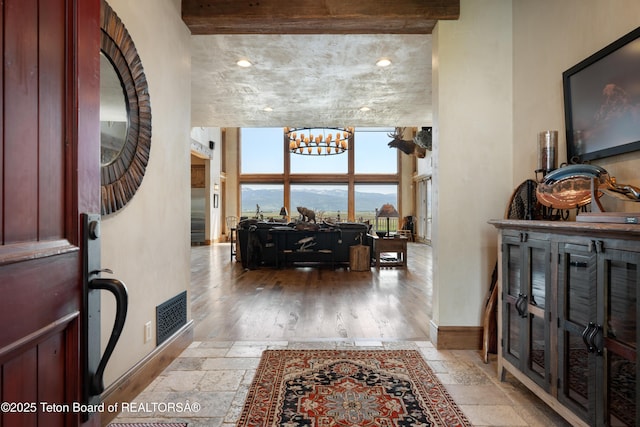 4053 S Adams Rd, Driggs, ID 83422 - foyer featuring a chandelier and stone tile floors